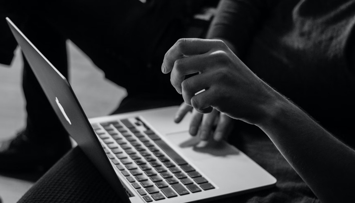 A representational image shows a person using a laptop. — Unsplash/File