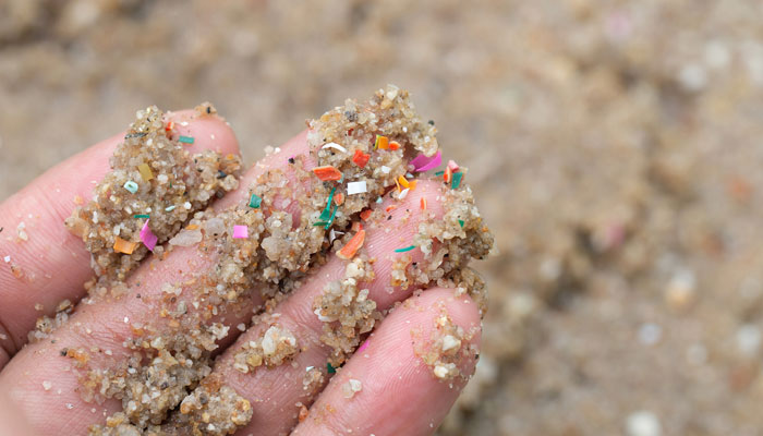 The picture shows a man with microplastics that have become nearly ubiquitous in our water bodies. — Shutterstock.