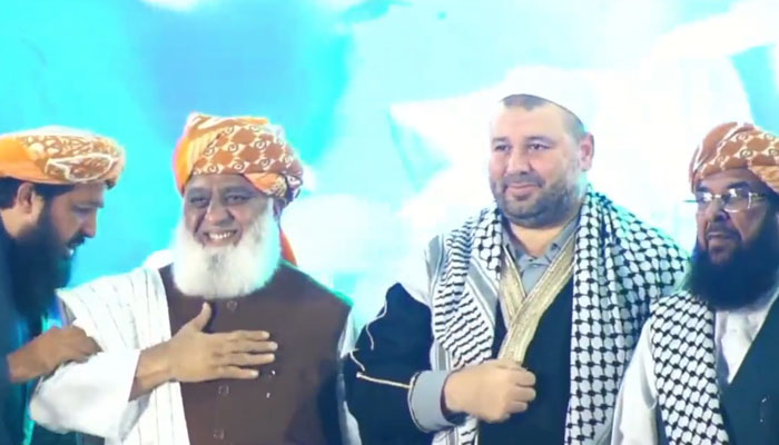 Jamiat Ulema-e-Islam-Fazl (JUI-F) chief Maulana Fazlur Rehman standing in front of a rally on Nov 2, 2023 to express solidarity with Palestine, in this still taken from a video. — X/ MAsimRasheed7