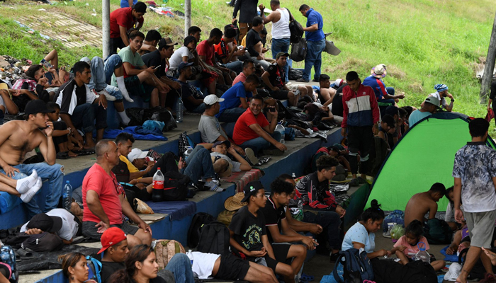 Migrants rest during a caravan towards the border with the United States in Huehuetan, Chiapas State, Mexico, on November 1, 2023. — AFP