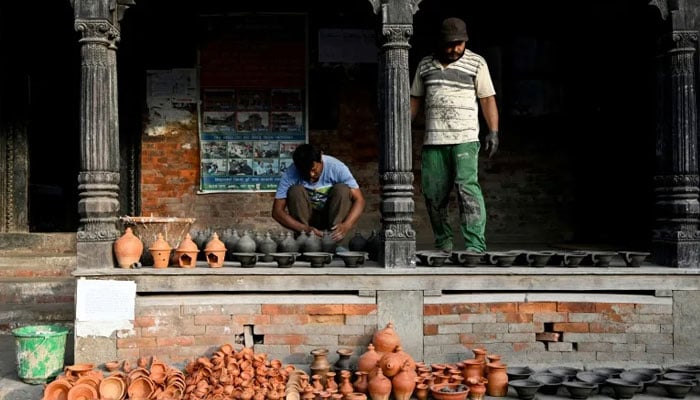 People prepare for a festival in Bhaktapur, on the outskirts of Kathmandu. —AFP/File