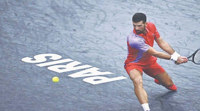 Djokovic fights virus to win in Paris; exhausted Sinner slams