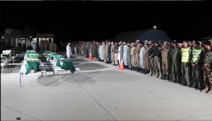 The picture shows the funeral prayers of the security personnel, who embraced martyrdom, being offered on Friday, in this still taken from a video. — Facebook/ Radio Pakistan