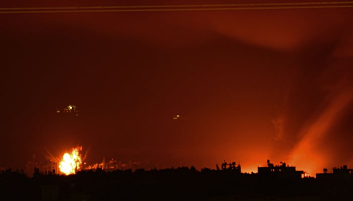 This picture taken on November 4, 2023, shows fire and smoke billowing following an airstrike by Israeli forces on the Palestinian enclave. — AFP