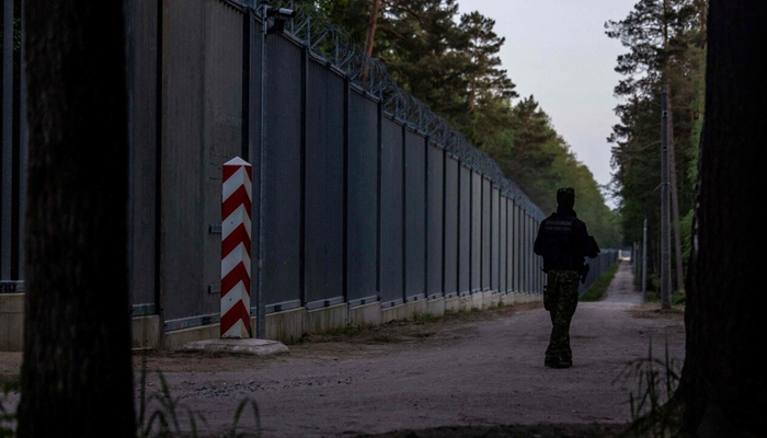 A border guard patrols along the Polish-Belarus border. — AFP/File