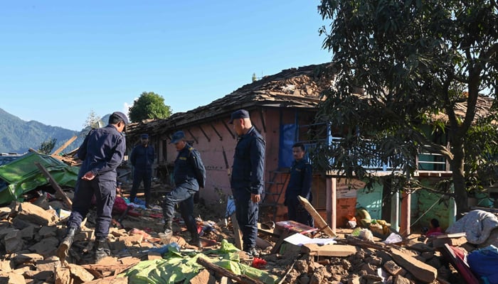 Nepali policemen inspect the rubble of houses in Jajarkot district on November 4, 2023, following an overnight 5.6-magnitude earthquake. — AFP