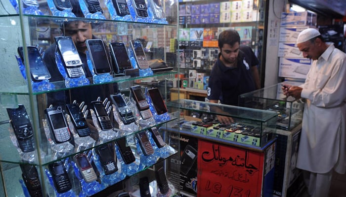 This representational image shows a mobile phone shop. — AFP/File