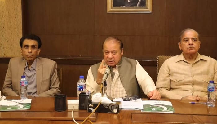 This still shows PMLN supremo Nawaz Sharif speaking with the media flanked by MQM-P Convener Dr Khalid Maqbool Siddiqui (L) and former PM Shehbaz Sharif after meeting with the MQM-P delegation on November 7, 2023. — Facebook/PMLN