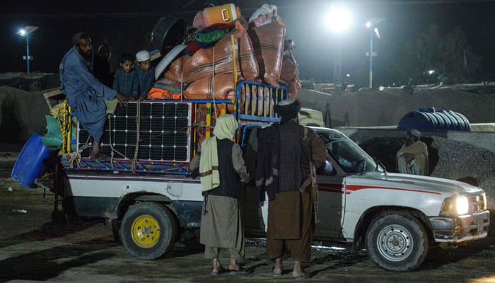 This photograph on November 6, 2023, shows Afghan refugees arriving with their belongings from Pakistan at a registration centre after crossing the Afghanistan-Pakistan border in Kandahar province. — AFP