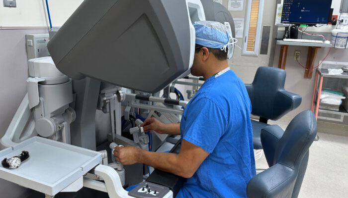 A surgeon performs robotic surgery on a patient. — Washington University School of Medicine