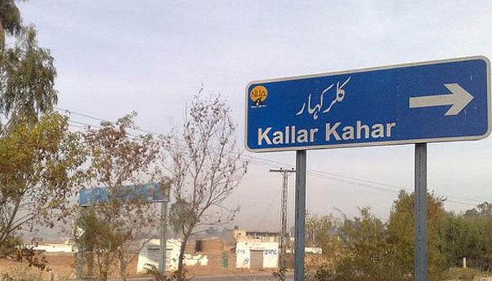 A signboard indicating the direction of Kallar Kahar.  — APP/File