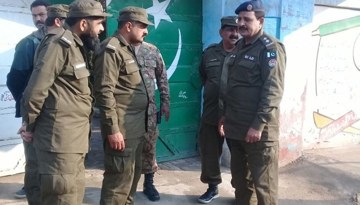 This image shows Punjab Police personnel speaking to each other. — AFP/File