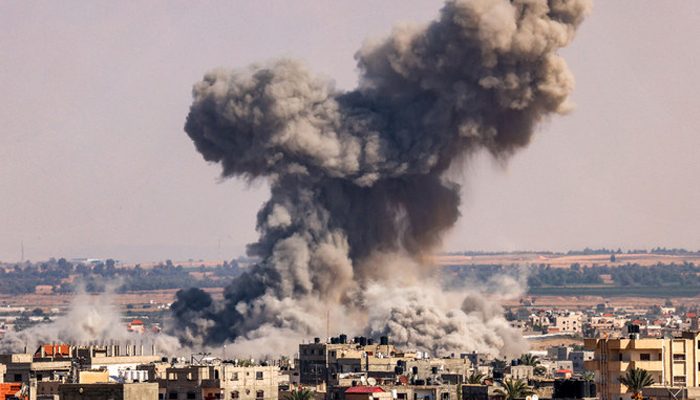 A smoke plume erupts during Israeli bombardment in Rafah in the southern Gaza Strip on October 19, 2023. — AFP