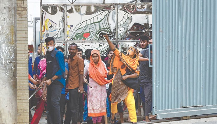 Garments factory workers clash with police during a rally in Gazipur, on Thursday.—AFP