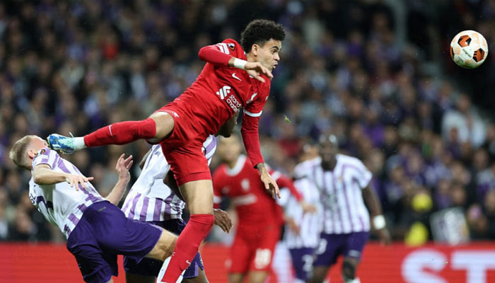 Liverpools Colombian midfielder #07 Luis Diaz (C) heads the ball ahead of Toulouses Danish defender #03 Mikkel Desler Puggaard (L) during the UEFA Europa League Group E match between Toulouse FC (TFC) and Liverpool at the Stadium de Toulouse, in Toulouse, southwestern France on November 9, 2023. — AFP