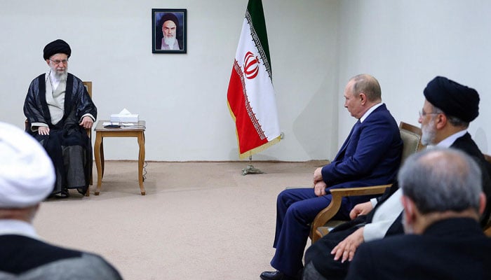 In this undated photo, Russian president Putin is seen sitting in front of Irans Supreme Leader Ayatollah Ali Khamenei and along Iranian President Ebrahim Raisi in Tehran. — AFP Flie