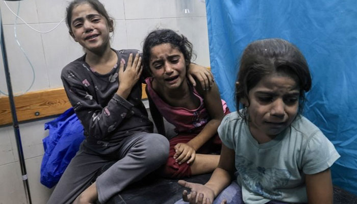 In this undated photo, three distressed Palestinian children are seen. —AFP/File