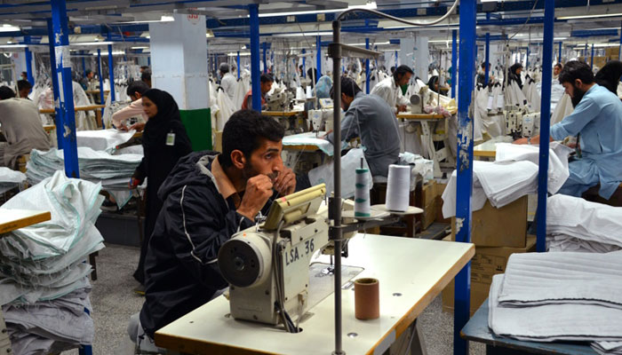 Workers inside a garment factory. — Ecotextile News