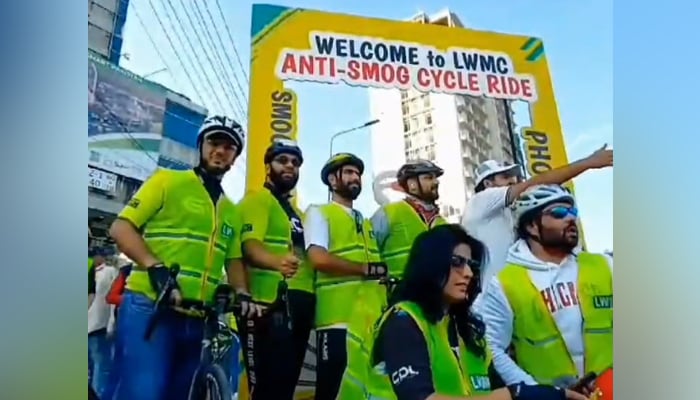 This still on November 12, 2023, shows participants of a smog awareness family ride. — Facebook/Lahore Waste Management Company