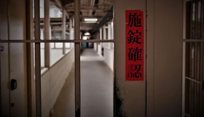 A sign reads check door lock on a gate inside Tochigi prison, Japans largest womens prison, January 31, 2019. — Yo Nagaya