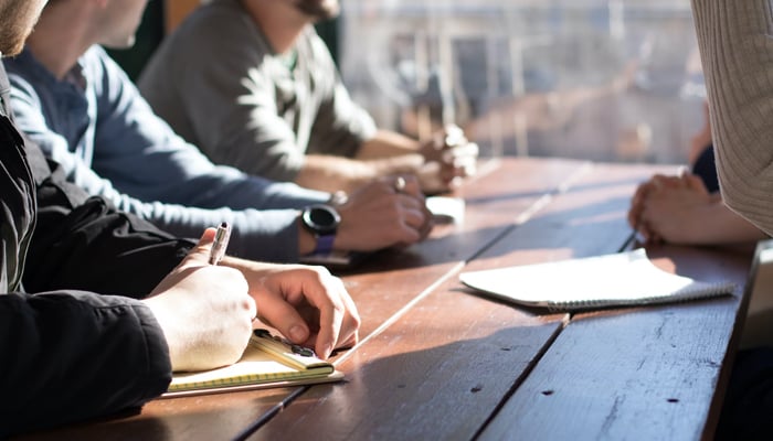 A representational image of a meeting. — Unsplash/File