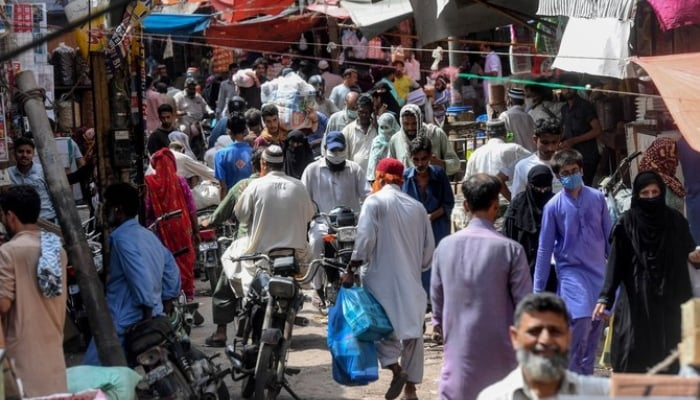 Residents shop at a wholesale market in Karachi. —  AFP/File