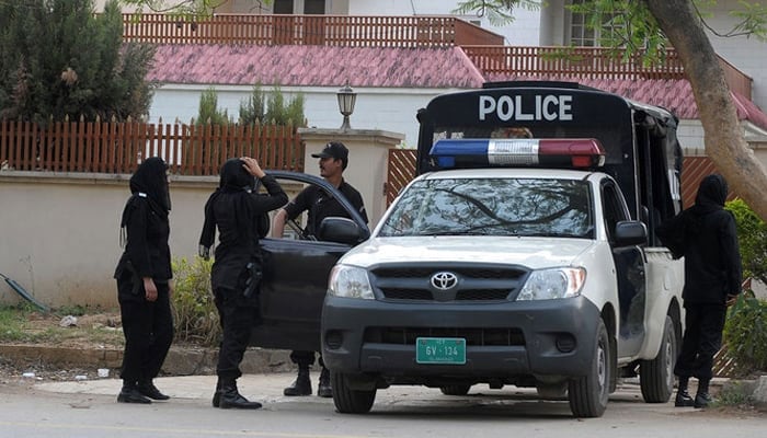 A police vehicle is seen standing guard in Islamabad. — AFP/File