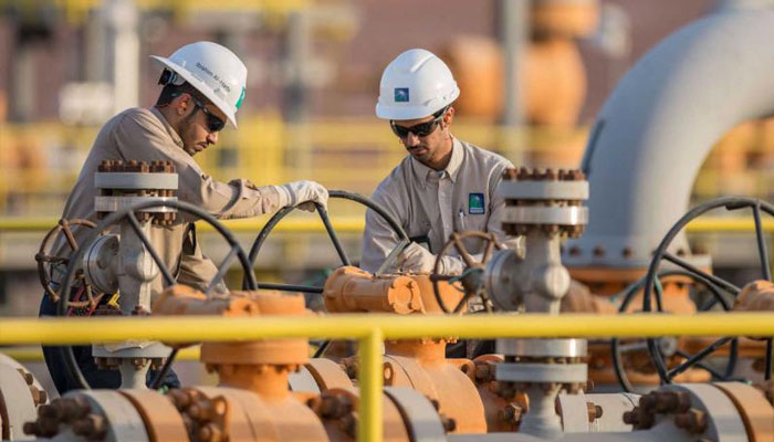 ARAMCO engineers working on an eastern Saudi oil installation. — AFP File