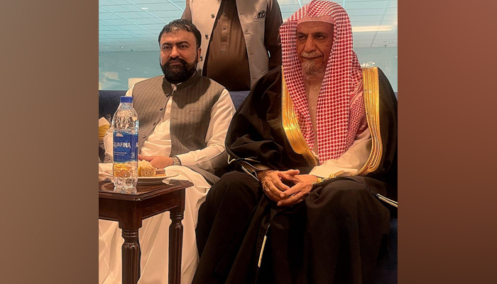 Imam-e-Kaaba Sheikh Saleh bin Humaid sits with the interim federal Interior Minister Sarfraz Bugti on November 22, 2023. — X/@MOIofficialGoP