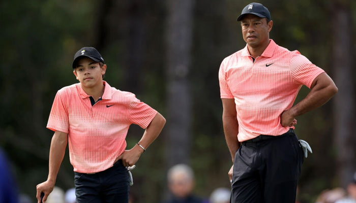 Tiger Woods, right, and his teen son Charlie, left, will compete in next months PNC Championship, a parent-child 36-hole tournament. — AFP File