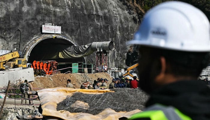 A rescue officer stands near the entrance to the Silkyara tunnel: engineers began digging on November 12 through some 57 metres (187 feet) of earth, concrete and rubble. — AFP File