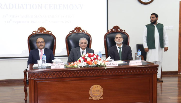 Caretaker Minister for Planning, Development and Special Initiatives Muhammad Sami Saeed Addressing the Certificate Award Ceremony of the 38th Mid-Career Management Course at the National Institute of Management (NIM). —APP