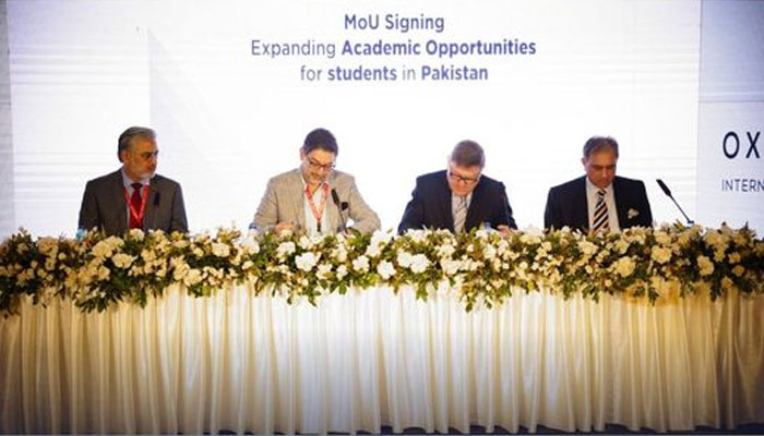 The image shows the signing cermeony of the MoU between Beaconhouse and OxfordAQA. —Facebook/CohortMax