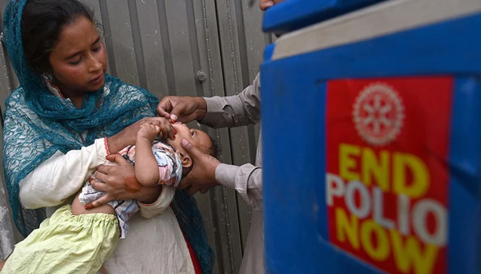 A health worker administers polio a vaccine. — AFP/File