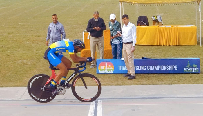 A cyclist arrives at the finishing line during the 68th National Track Cycling Championship at Lahore Velodrome on Nov 26, 2023. —Facebook/PCFOfficial