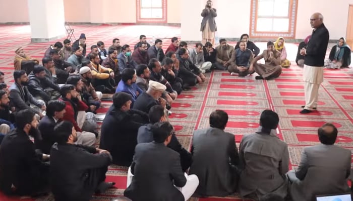 Chairperson of Benazir Income Support Programme Dr. Muhammad Amjad Saqib speaks to the people  at Usmania Masjid Muzaffarabad in this still on November 27, 2023. — Facebook/BISP Pakistan