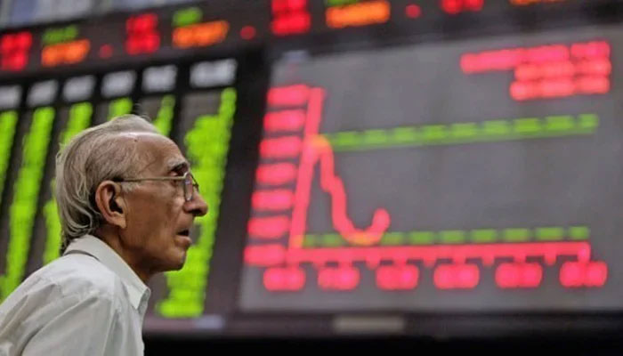 An investor can be seen looking at the digital stock board at the Pakistan Stock Exchange in this undated image. — AFP/File