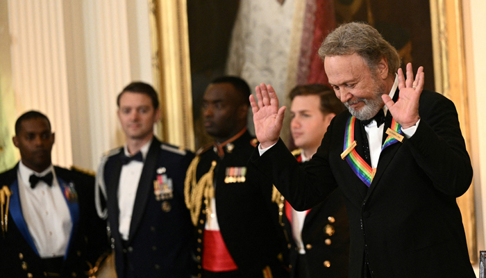 US actor and comedian Billy Crystal reacts during a reception for the 46th Kennedy Center Honors Gala, in the East Room of the White House in Washington, DC, on December 3, 2023. — AFP