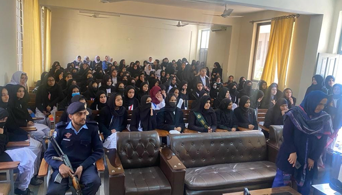 This image shows Islamabad Police officials during a session with the female students on December 4, 2023. — Facebook/Islamabad Police