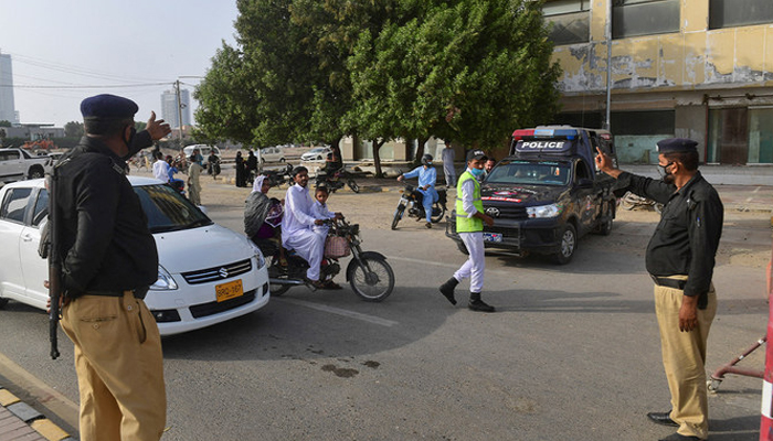 This image shows police officials on a road in Karachi. — AFP/File