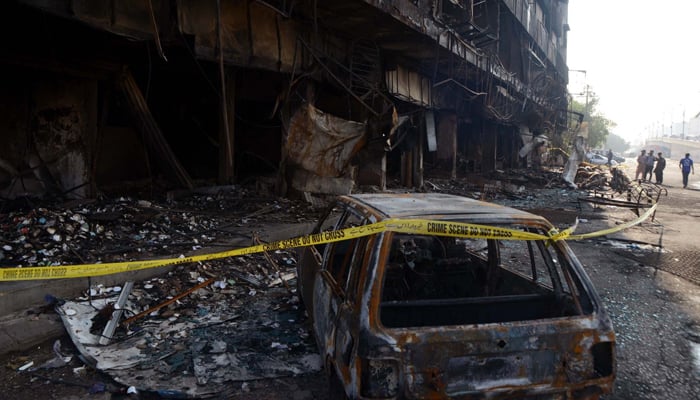 View of massive fire left a multi-storey building after fire eruption incident at Furniture Market in a residential building, located near Ayesha Manzil in Karachi December 7, 2023. — PPI