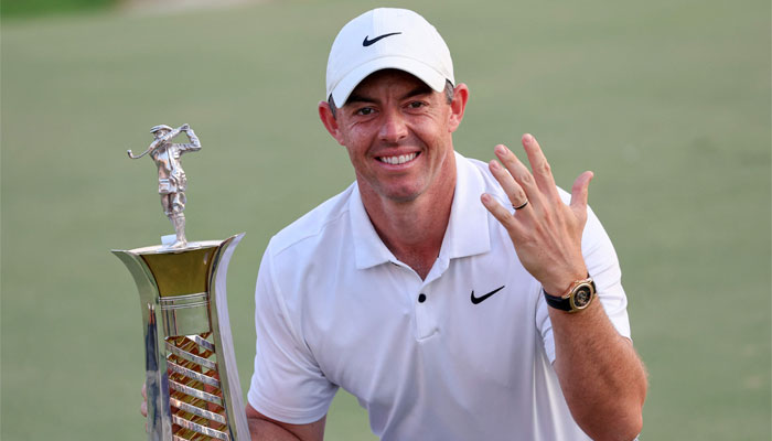 Rory Mcllroy poses for a picture with the world championship trophy after the last day of the DP World Tour Championship European Tour golf tournament 2023 at Jumeirah Golf Estates in Dubai on November 19, 2023. — AFP