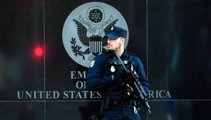 A police officer stands near the US Embassy in Madrid. — AFP/File