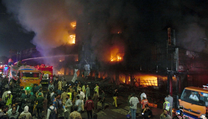 View of a site after fire eruption at Furniture Market as the rescue officials are busy extinguishing fire during a rescue operation in Karachi on December 6, 2023. — PPI