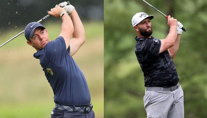 World number two Rory McIlroy (left) and Jon Rahm. — AFP File