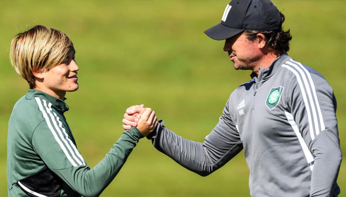 Harry Kewell (R) shakes hands with Celtics Japanese striker Kyogo Furuhashi. — AFP File