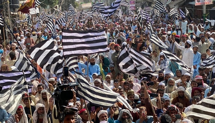 JUIF party supporters hold flags during a party rally in this image released on October 26, 2023. — Facebook/Jamiat Ulama-e-Islam Pakistan