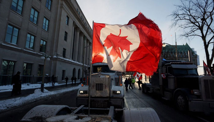 The Canadian flag flies upside-down on Parliament Hill on Jan. 28, 2023. — AFP