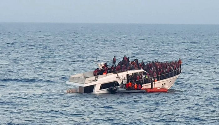 A migrant ship sails in a sea. — AFP/File