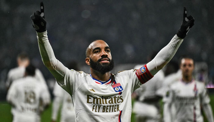 Lyons Alexandre Lacazette celebrates a goal against Toulouse. — AFP File